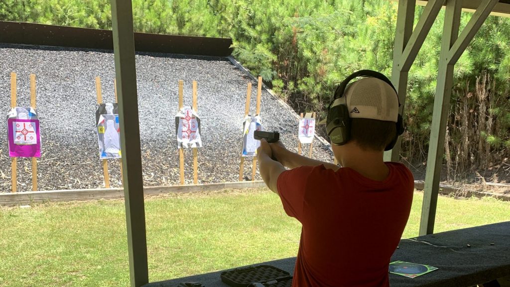 Gun saftey training a young boy