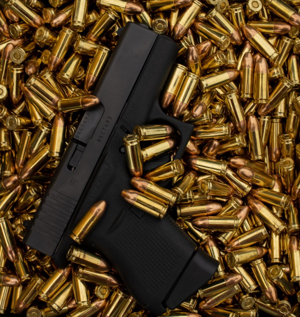 glock handgun on ammo bullets