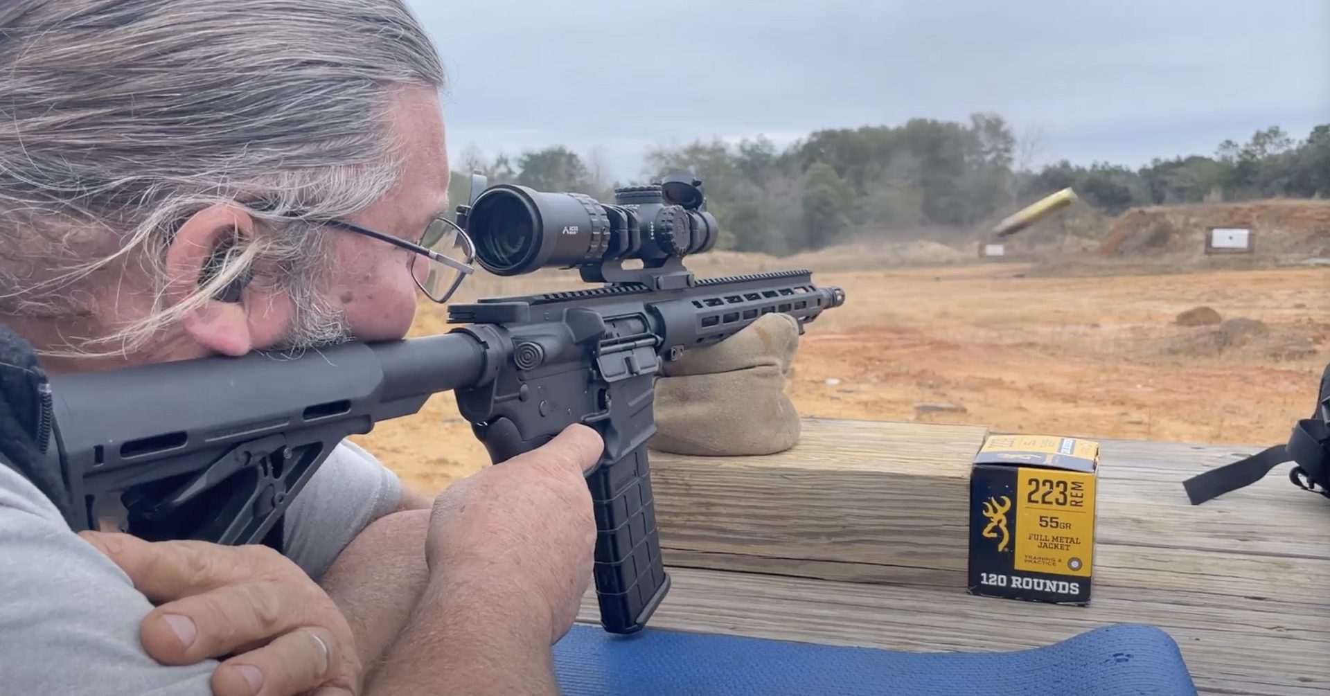 Chris Litton shooting a rifle with Primary Arms SLx 1-6x24mm LPVO scope