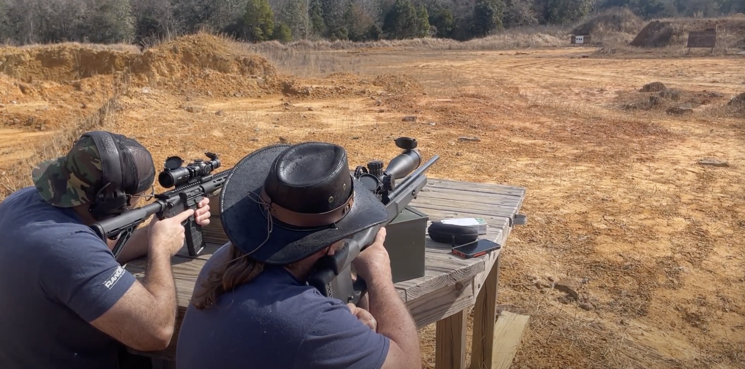 Paris Vega & Chris Litton shooting guns at the range