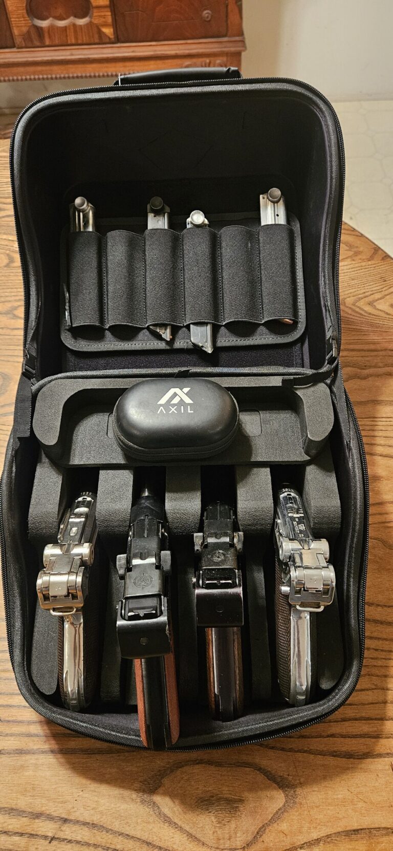 GRITR Pistol Pod fit test with four collectible Luger-style pistols and six magazines