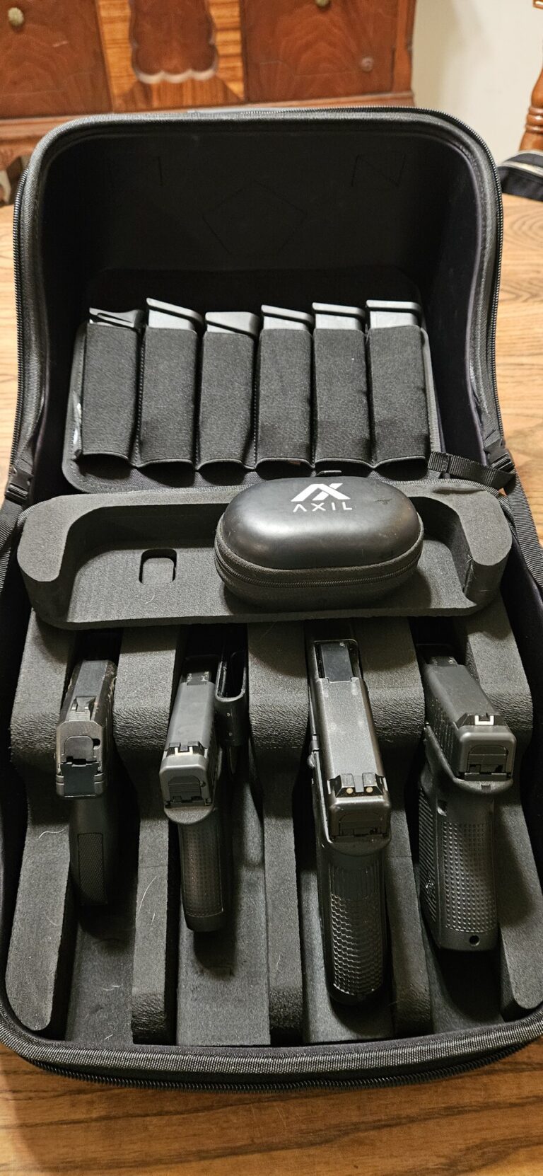 GRITR Pistol Pod holding a Glock 43, Glock 22, Glock 19, and Ruger EC9 in separate foam slots